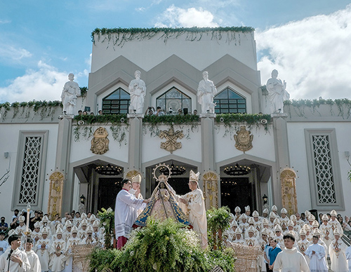 Bishop Ruperto Santos of Antipolo (right) and Archbishop Charles Brown, apostolic nuncio to the Philippines, crown the centuries-old image of Our Lady of Peace and Good Voyage outside Antipolo Cathedral, Jan. 26, 2024, before a Mass to mark the designation of the cathedral as an international shrine. (Photo by Roy Lagarde/CBCP News)