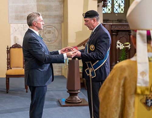 Supreme Knight Patrick Kelly formally installs Michael McCusker as supreme master at the conclusion of a Mass celebrated by Supreme Chaplain Archbishop William Lori (foreground) on April 14, 2023, at the Cathedral of St. Louis in New Orleans. (Photo by Beebe Tran)