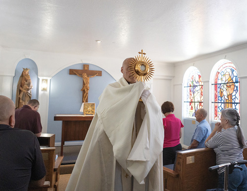 Father Santiago Iriarte, pastor of St. Ann Parish in Ridgefield, Calif., carries the Eucharist following Benediction at the parish’s Blessed Sacrament chapel May 9. The chapel was recently renovated with financial support from Father John Crowley Council 3199, for which Father Iriarte serves as chaplain. (Photo by Christine Bartolucci)