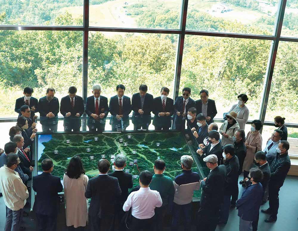 Knights and their families pray a rosary for peace at the Dora Observatory, near the border between South Korea and North Korea, in 2022. The Knights also attended Mass, celebrated by Bishop Titus Seo Sang-bum, at the only Catholic church in the Joint Security Area. Several Knights were instrumental in designing and constructing the church, which opened in 2019.