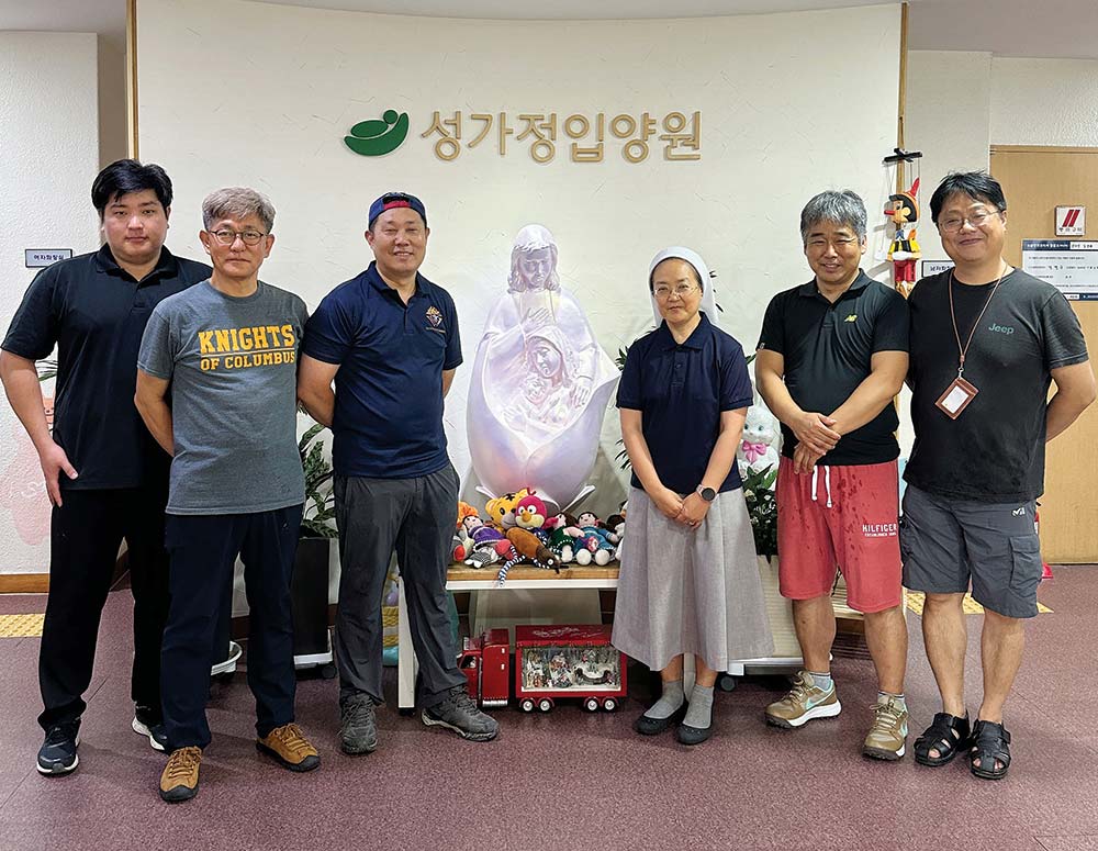 Knights in Seoul stand with Sister Alphoncia Yoon Mi-suk, director of the Holy Family Adoption Center, in August 2023. Members regularly volunteer at the center and last year refurbished its statue of the Holy Family.