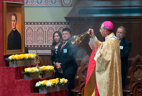 Supreme Chaplain Archbishop William Lori of Baltimore incenses a relic and image of Blessed Michael McGivney, founder of the Knights of Columbus, during Mass on June 7. (Photo by Tamino Petelinsek)