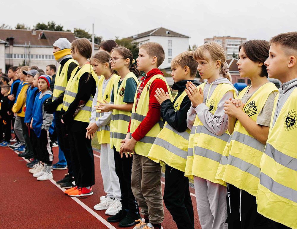 Children competing in the Knights of Columbus Cup in Ivano-Frankivsk on Oct. 5 say a prayer before the games begin.