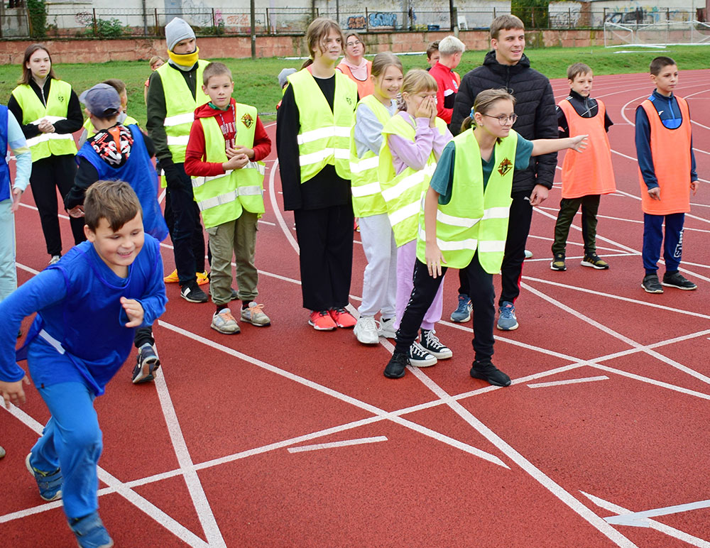 Runners line up for a relay race on the track at Ivano-Frankivsk National Technical University of Oil and Gas.  