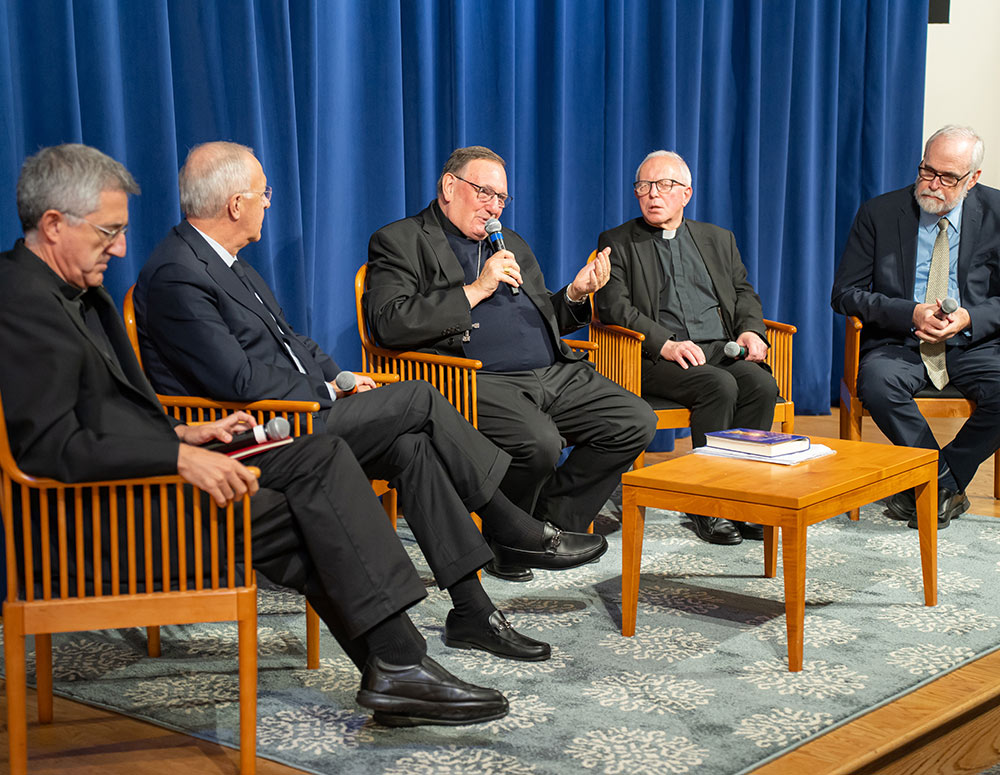 Bishop Jean Laffitte (center) answers questions about his book Oct. 9 at the Saint John Paul II National Shrine in Washington. He is joined, from left, by Father José Granados, superior general of the Disciples of the Hearts of Jesus and Mary; Past Supreme Knight Carl Anderson; Father George Woodall, an English scholar; and David Crawford, dean of the John Paul II Institute. (Photo by Sarah Davis) 