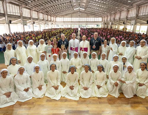 Supreme Knight Patrick Kelly is pictured with the Sisters of Mary and students at Girlstown in Cavite, Silang, on Aug. 24. Joining them are the Kelly family; Archbishop Charles Brown, apostolic nuncio to the Philippines; Supreme Chaplain Archbishop William Lori; and Supreme Master Michael McCusker. (Photo by Tamino Petelinšek)