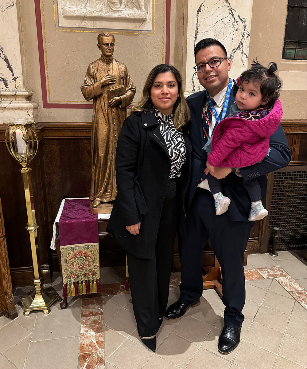 Miguel Flores visits St. Joseph Church in New Haven with his wife, Claudia, and their daughter, Alessia, during a pilot event for the McGivney Leader Fellowship in 2023. St. Joseph is one of the eight churches in New Haven — including St. Mary’s Church — that comprise Blessed Michael McGivney Parish.