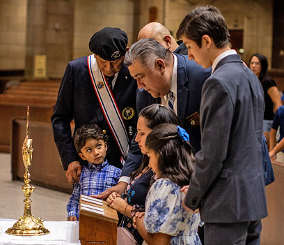 Knights and their family members venerate a first-class relic of Blessed Michael McGivney after Mass at the Basilica of Our Lady of San Juan Del Valle, in San Juan, Texas