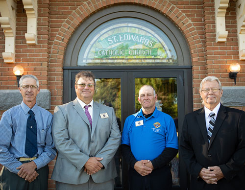 From left, Jim Wensmann, Jeff Czech, John Kokett, and Jim Bartkowicz — all members of St. Gregory the Great Council 12604 in Bowlus, Minn. — stand in front of St. Edward’s Church in Elmdale on June 29. The Knights were instrumental in restoring the church after the fire. (Photo by Kimm Anderson)