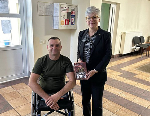 Mykola V’yuk is pictured with a copy of Sergeant V’yuk by Andriy Chobot, a book about his experiences as a soldier and the impact of the war on his life.